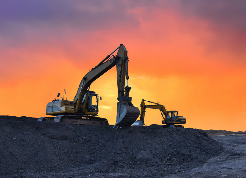 Excavator working on earthmoving at open pit mining