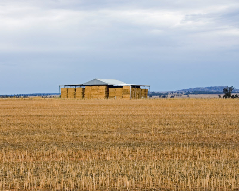 distant hay shed on a remote farm