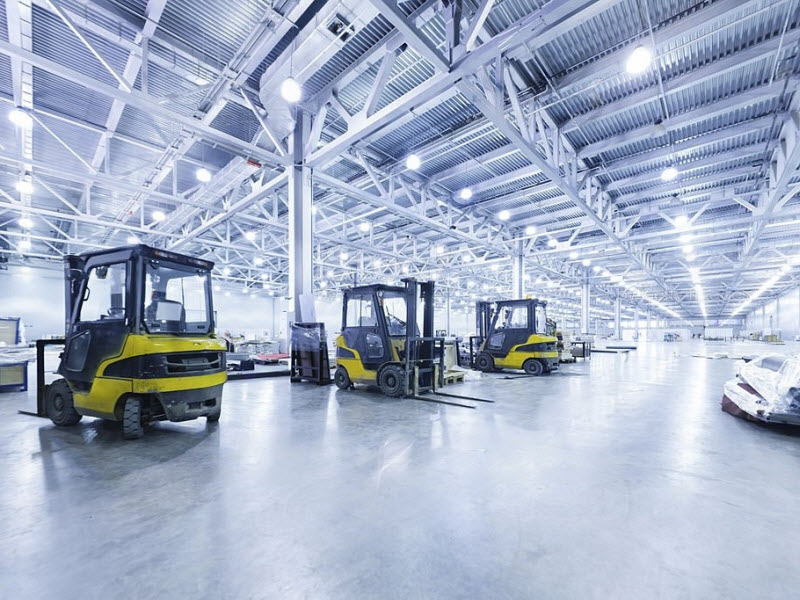 Forklifts inside the industrial warehouse
